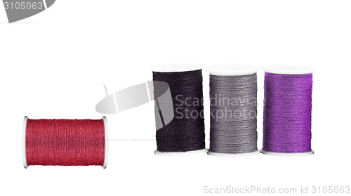 Image of Colourful spools of thread isolated on white background