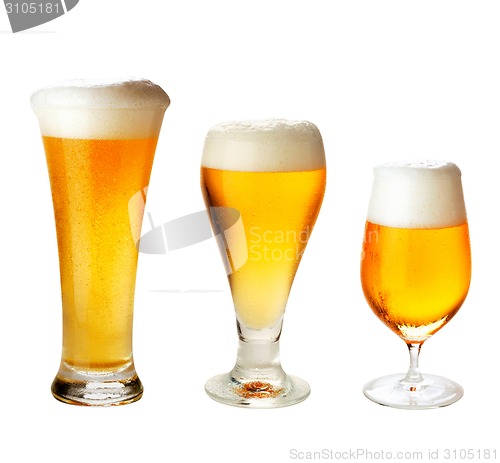 Image of set with different glasses of beer on white