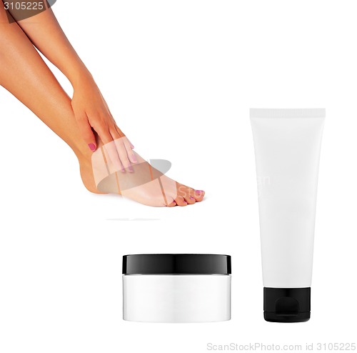 Image of two bottles of cream and a beautiful leg women