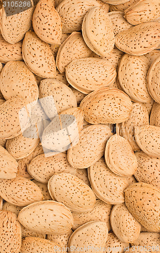 Image of Pile of almonds close-up as background.