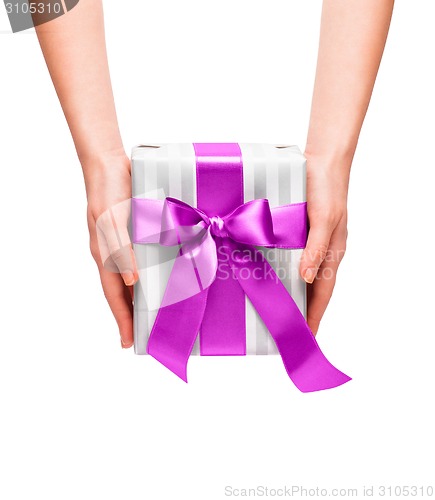 Image of male holding gift box with a bow