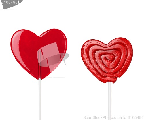 Image of two red heart-lollipops isolated