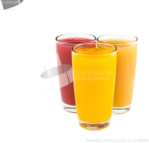 Image of Tropical juices in glasses isolated on white