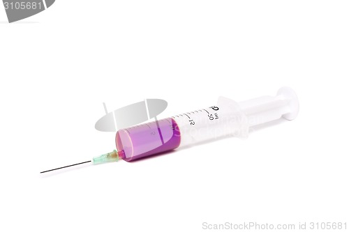 Image of syringe with purple medication 