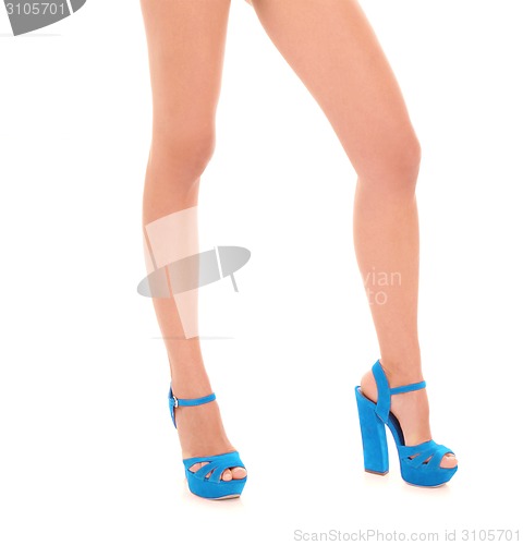 Image of female legs wearing high heels isolated on white background