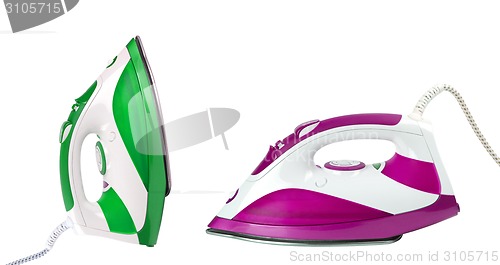 Image of two steam irons isolated on white background