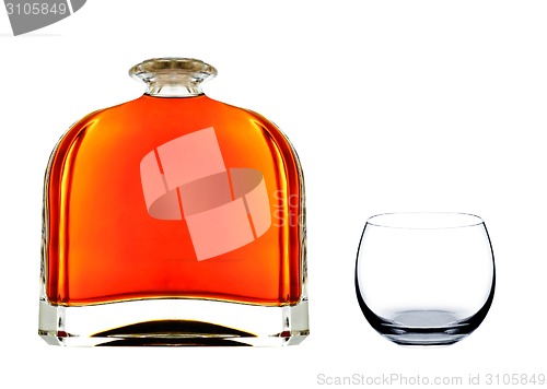 Image of cognac in bottle with glass