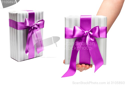 Image of male holding gift box with a bow