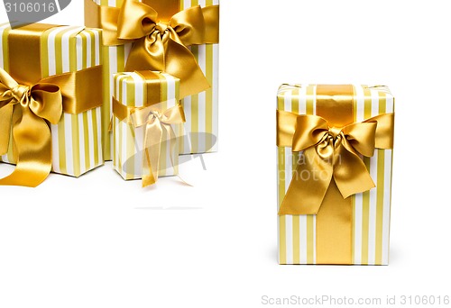 Image of Gold gift boxes isolated on white