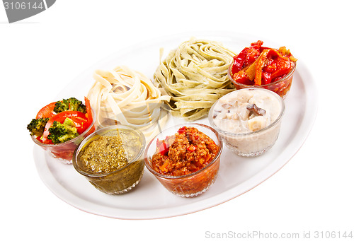 Image of two italian tagliatelles and five various condiments