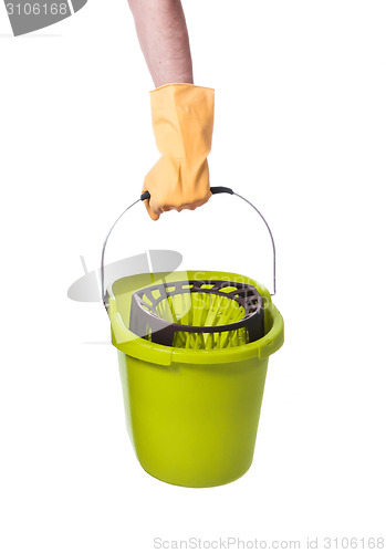 Image of Human hand holding empty plastic bucket container