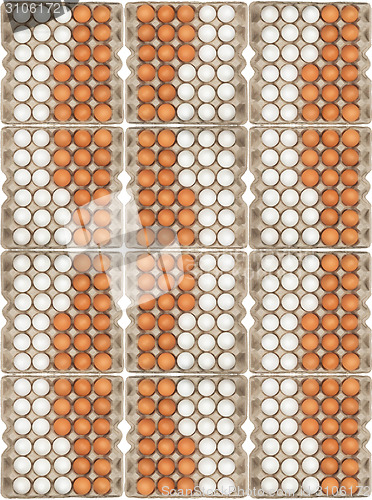 Image of white and brown eggs in the box