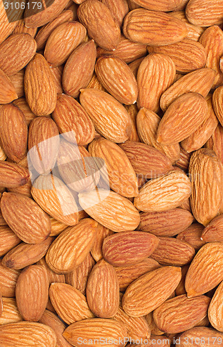 Image of Pile of almonds close-up as background.