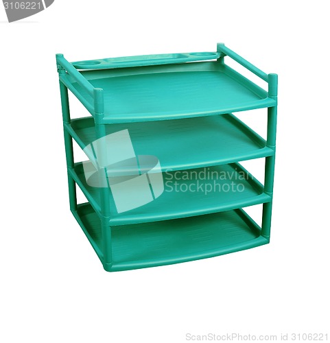 Image of Green plastic shelves isolated on white