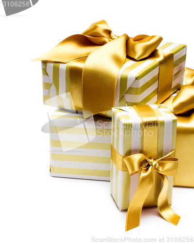 Image of Gold gift boxes isolated on white background