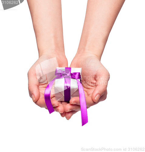 Image of christmas gift with decorative pink ribbon bow