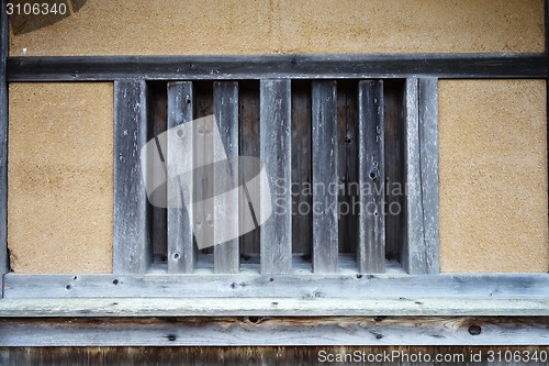 Image of Old cabin house with wooden window