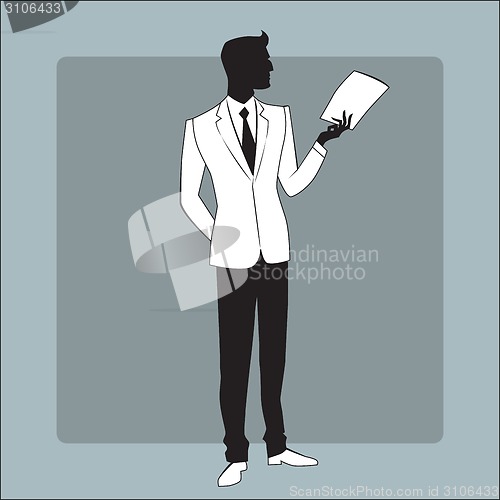 Image of Businessman in modern clothes reads the report