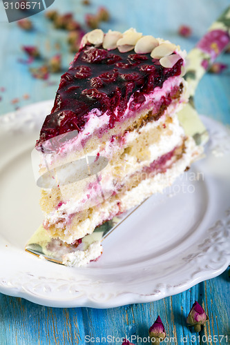 Image of Piece of cake with cherries.