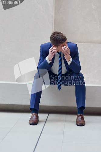 Image of frustrated young business man