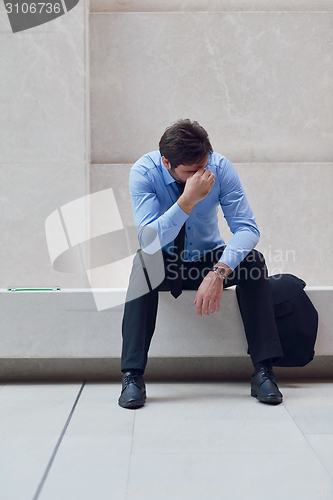 Image of frustrated young business man