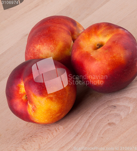 Image of Three tasty fresh ripe juicy nectarines