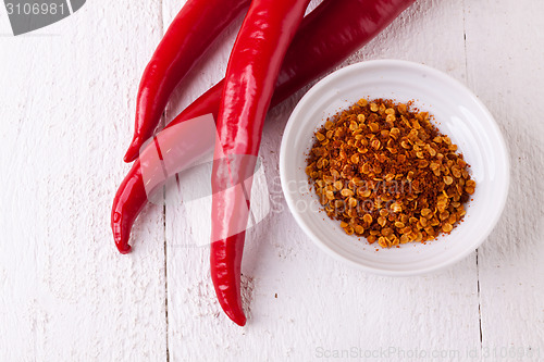 Image of Fresh red and yellow chili peppers with spice