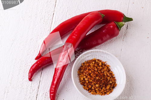 Image of Fresh red and yellow chili peppers with spice