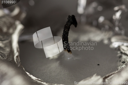Image of Burnt extinguished wick on a candle