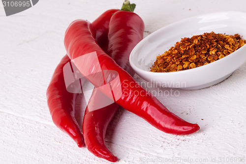 Image of Fresh red and yellow chili peppers with spice