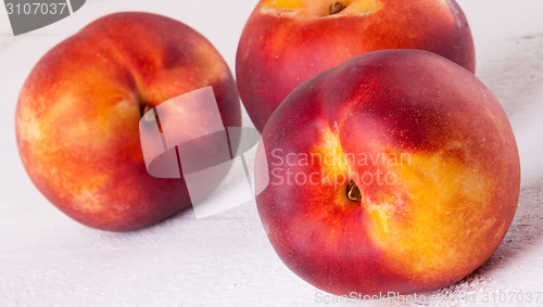 Image of Three tasty fresh ripe juicy nectarines