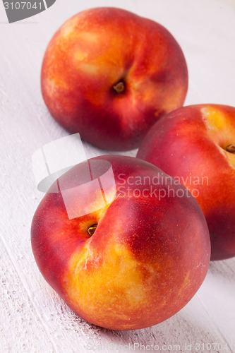 Image of Three tasty fresh ripe juicy nectarines