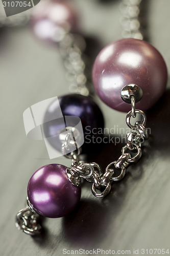 Image of Attractive shiny purple beads on jewellery