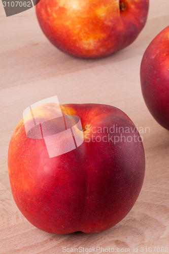 Image of Three tasty fresh ripe juicy nectarines