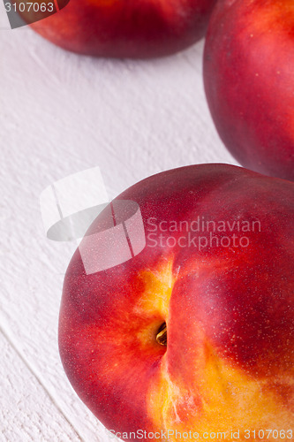 Image of Three tasty fresh ripe juicy nectarines