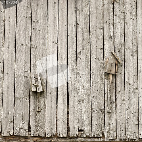 Image of two old broken homemade birdhouses