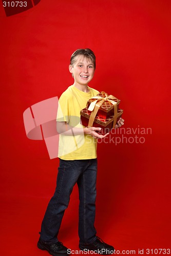 Image of Happy boy with Christmas gifts