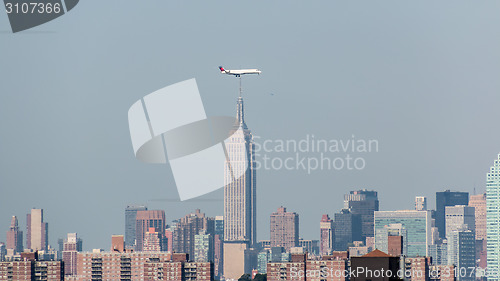 Image of Planes flying above the skyscrapers