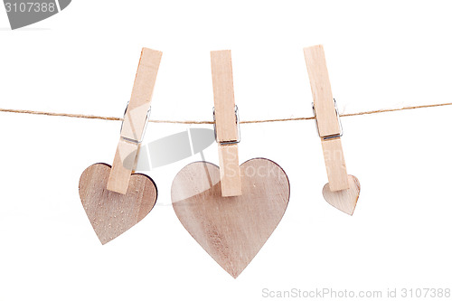 Image of wooden heart hanging on the clothesline