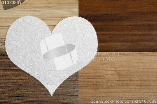 Image of valentine's snow hearts on a wooden background