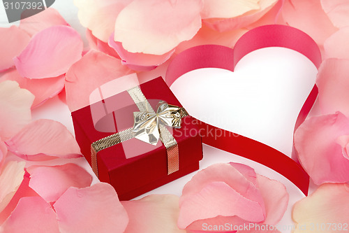 Image of rose petals, heart and valentine present box background