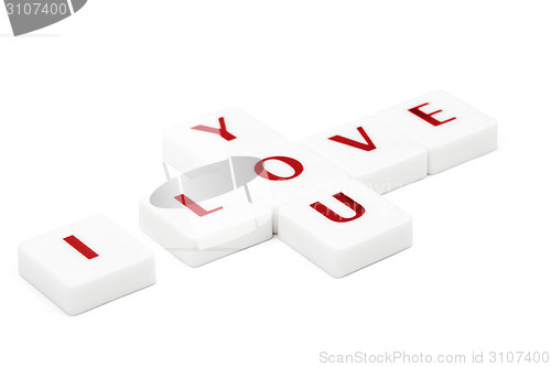 Image of Scrabble letters spelling I love you isolated on white