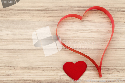 Image of valentine's paper hearts on a wooden background