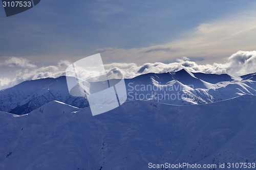 Image of Winter mountains at evening and sunlight clouds