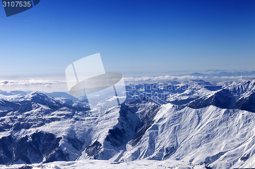 Image of Winter snowy mountains in sun day