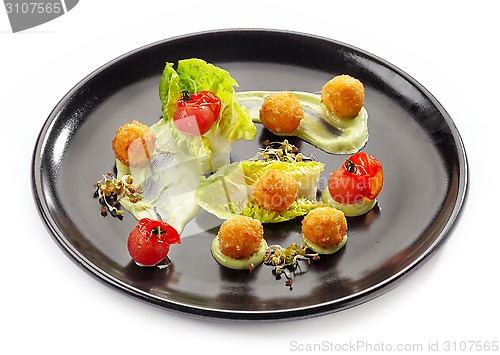 Image of Plate of cheese balls and vegetables