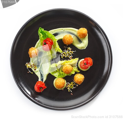 Image of Plate of cheese balls and vegetables