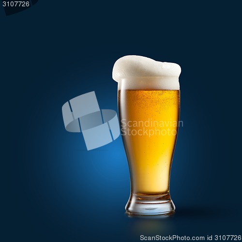 Image of Beer in glass on blue