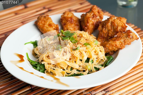 Image of Chicken Wings with Noodles and Spinach