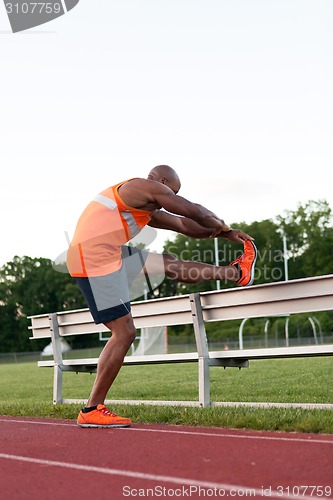 Image of Track and Field Runner Stretching